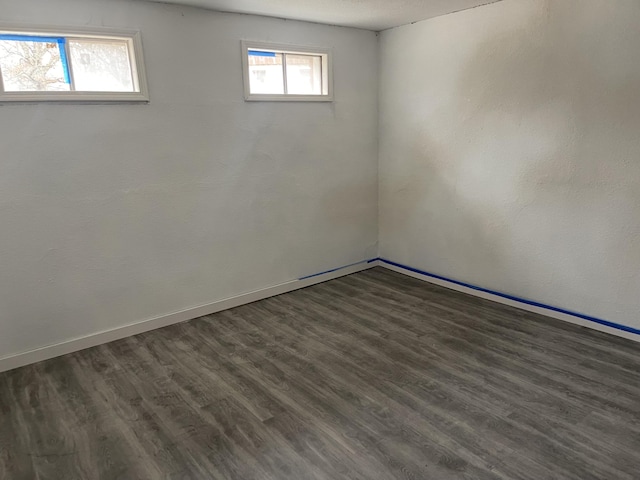 basement featuring dark hardwood / wood-style floors