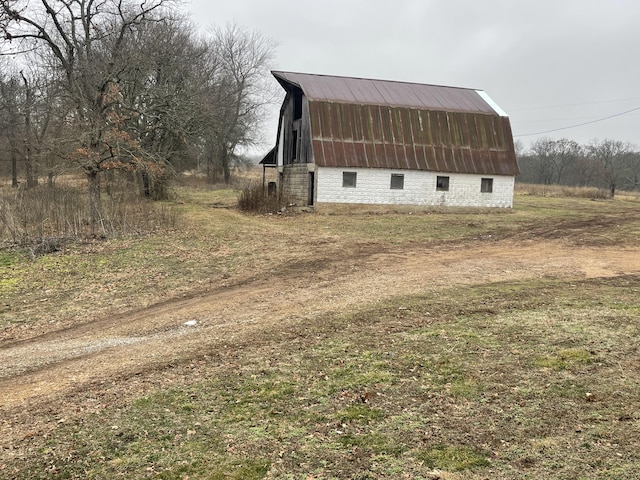 view of side of property with an outbuilding