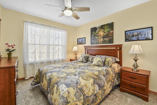 bedroom with light colored carpet and ceiling fan