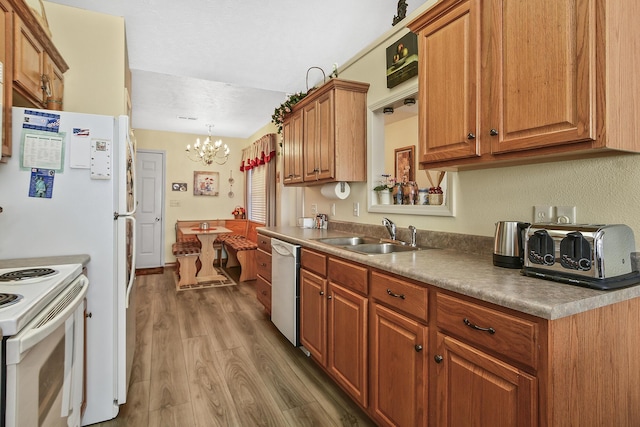 kitchen featuring sink, dishwashing machine, dark hardwood / wood-style flooring, hanging light fixtures, and white electric range oven