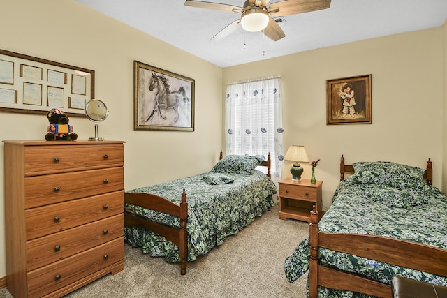 bedroom featuring ceiling fan and carpet flooring