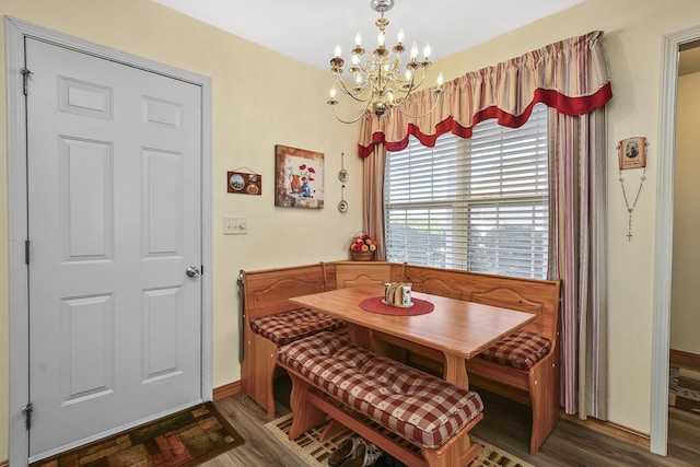 dining area featuring hardwood / wood-style flooring, a chandelier, and breakfast area