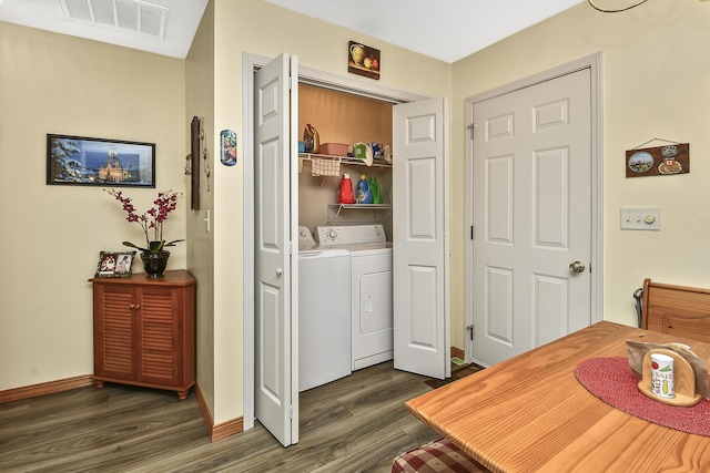 laundry room featuring dark hardwood / wood-style floors and independent washer and dryer