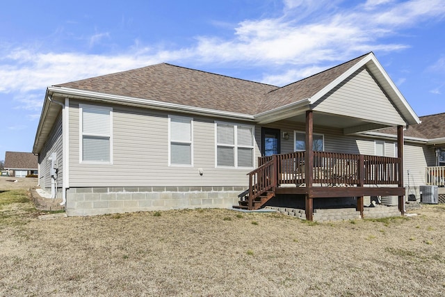 back of house with a wooden deck, a yard, and cooling unit