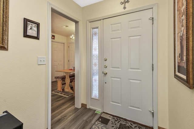 foyer featuring dark wood-type flooring