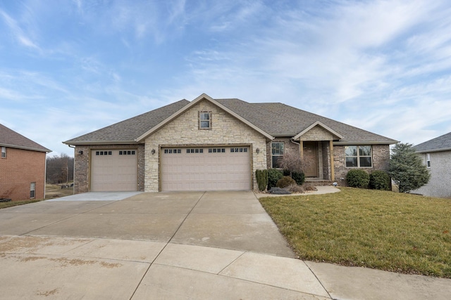 view of front facade with a garage and a front lawn