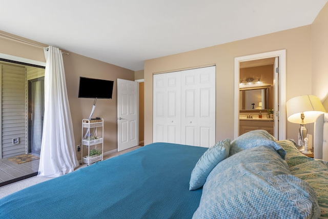 bedroom with ensuite bath and a closet