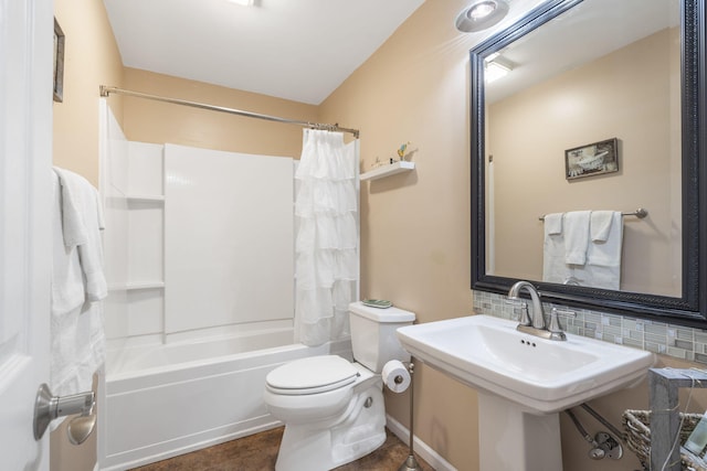 full bathroom with shower / tub combo, sink, tasteful backsplash, and toilet