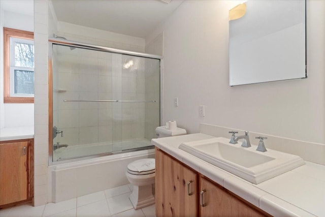 full bathroom with vanity, tile patterned floors, enclosed tub / shower combo, and toilet