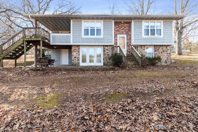 view of front of house featuring a deck and french doors