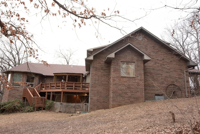 rear view of property with a deck