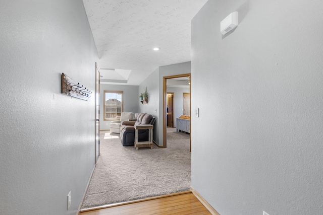 corridor with hardwood / wood-style floors