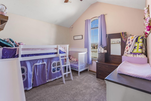 bedroom with ceiling fan, carpet floors, and vaulted ceiling