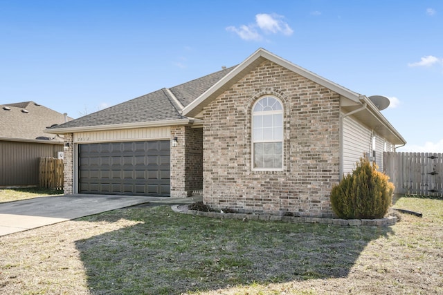 view of front of house with a garage and a front lawn