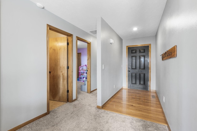 view of carpeted foyer