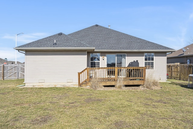 back of property featuring a yard and a deck