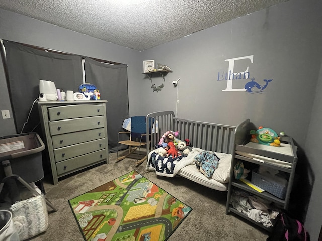 bedroom with carpet flooring and a textured ceiling