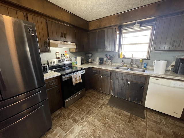 kitchen with sink, dark brown cabinets, stainless steel appliances, a textured ceiling, and decorative backsplash