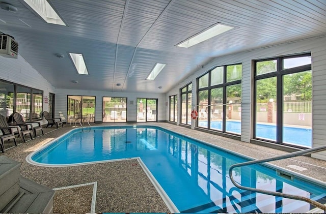 view of pool featuring a skylight