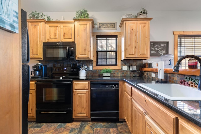 kitchen with plenty of natural light, sink, decorative backsplash, and black appliances