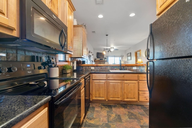 kitchen featuring sink, ceiling fan, black appliances, decorative backsplash, and kitchen peninsula