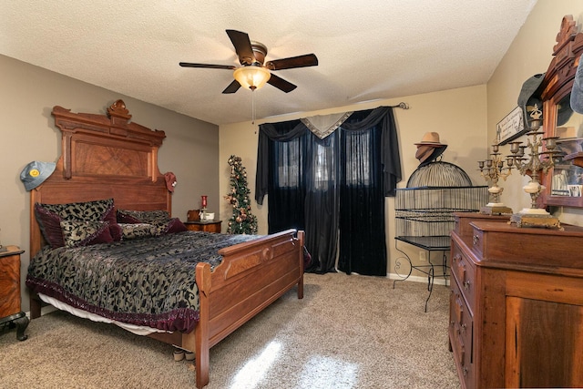 bedroom with ceiling fan and a textured ceiling