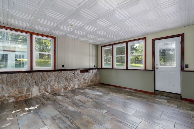 unfurnished sunroom featuring plenty of natural light