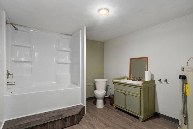 full bathroom with water heater, vanity, wood-type flooring, shower / washtub combination, and toilet