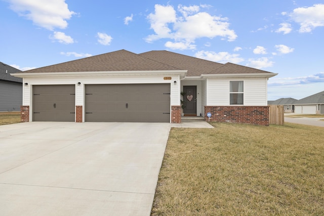 view of front of home with a garage and a front yard