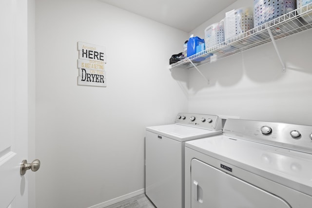 laundry area with washing machine and dryer