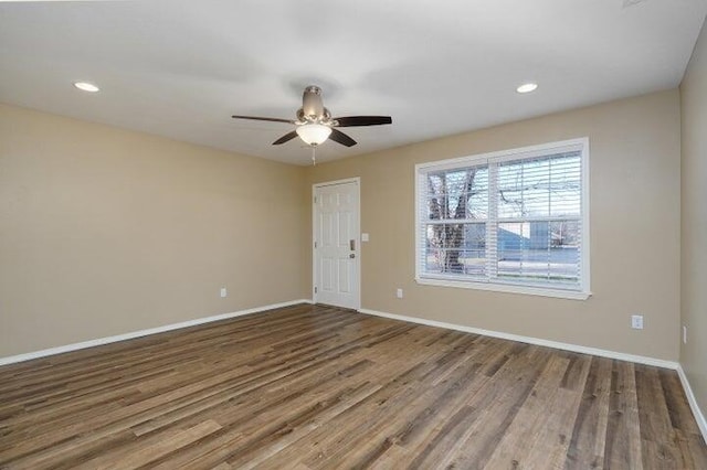 unfurnished room featuring hardwood / wood-style flooring and ceiling fan