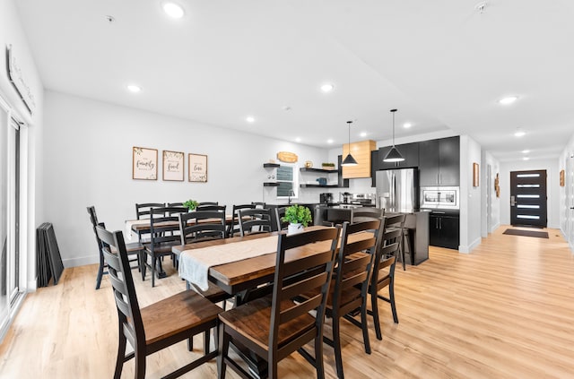 dining room with light wood-type flooring