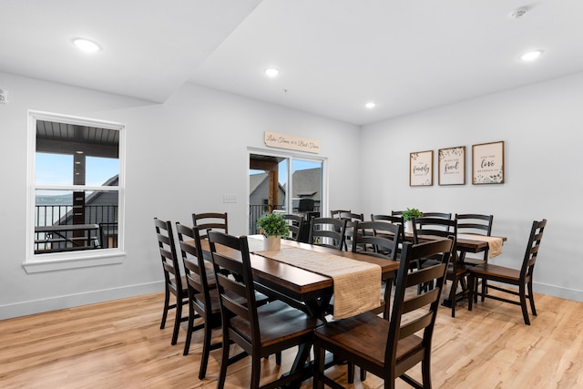 dining space featuring a healthy amount of sunlight and light wood-type flooring