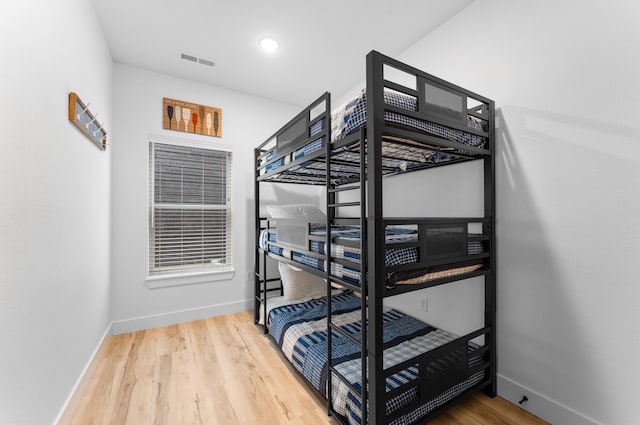 bedroom with wood-type flooring