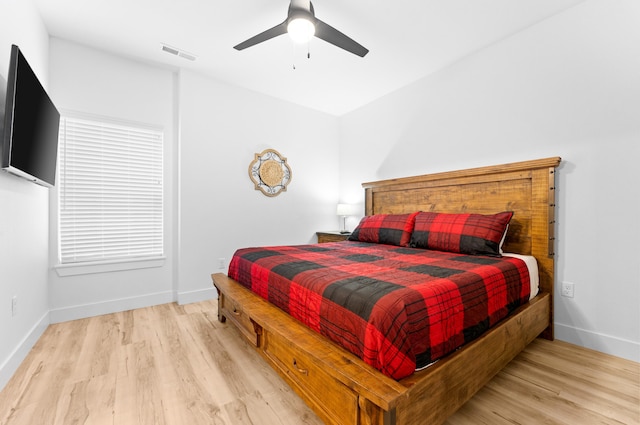 bedroom featuring light hardwood / wood-style flooring and ceiling fan