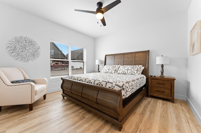 bedroom with ceiling fan and light wood-type flooring