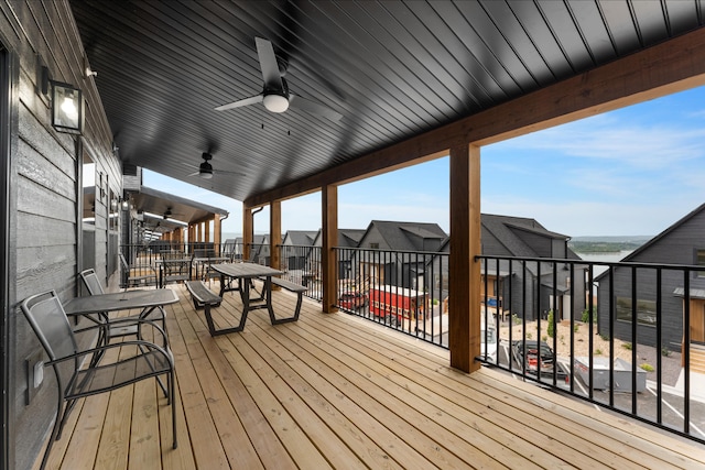 wooden deck featuring ceiling fan