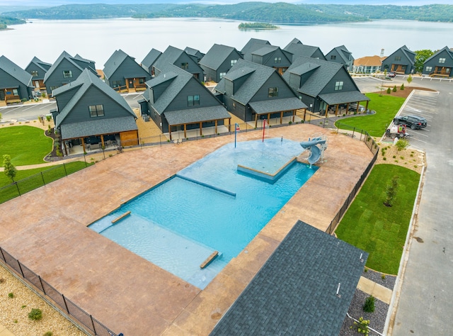 view of pool featuring a water view