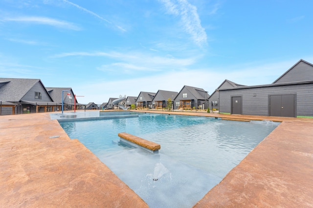 view of swimming pool with a patio area