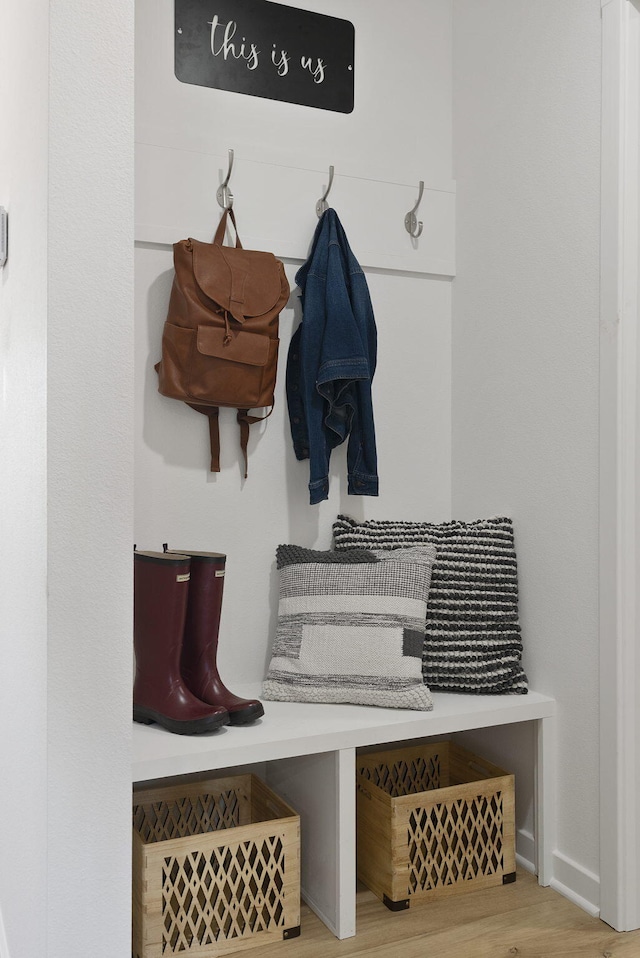 mudroom with light hardwood / wood-style floors