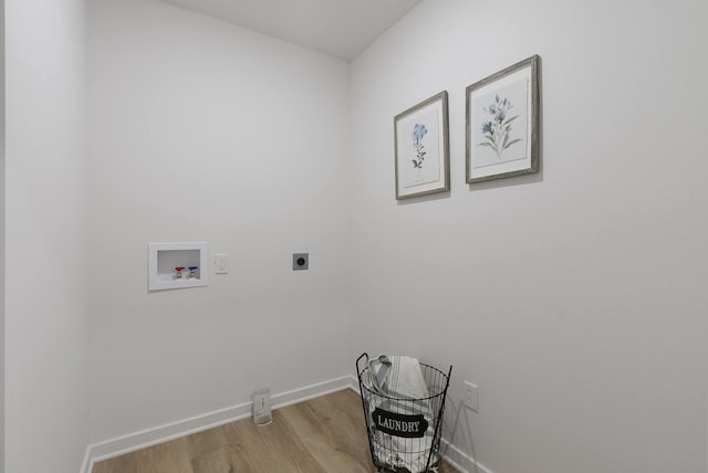 clothes washing area with hookup for a washing machine, electric dryer hookup, and light hardwood / wood-style floors