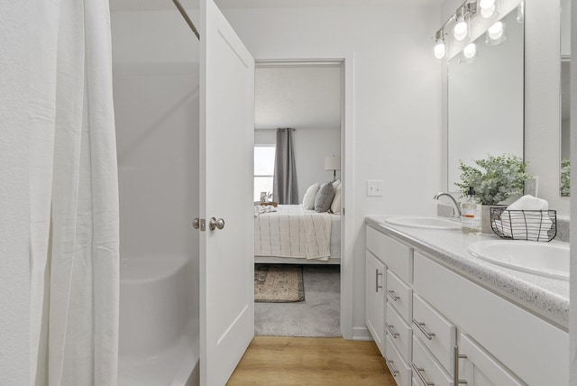 bathroom featuring vanity and hardwood / wood-style floors