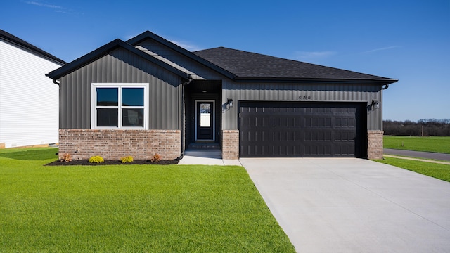 view of front of house with a garage and a front yard