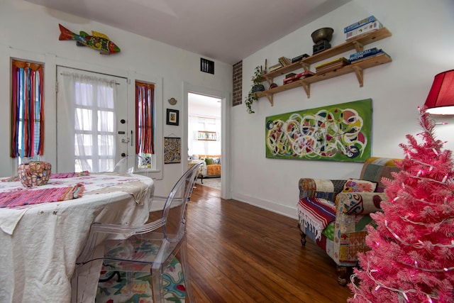 dining area with dark hardwood / wood-style floors