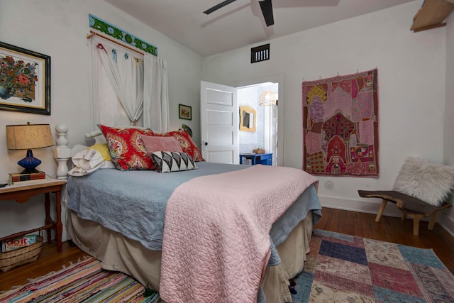 bedroom featuring dark hardwood / wood-style flooring and ceiling fan