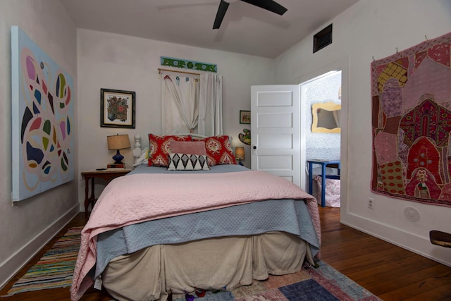 bedroom with ceiling fan and dark hardwood / wood-style floors