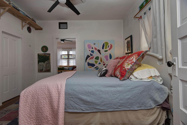 bedroom featuring wood-type flooring and ceiling fan