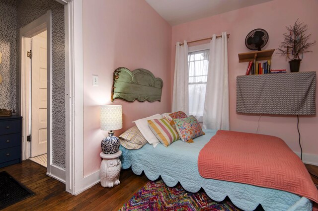 bedroom featuring dark wood-type flooring