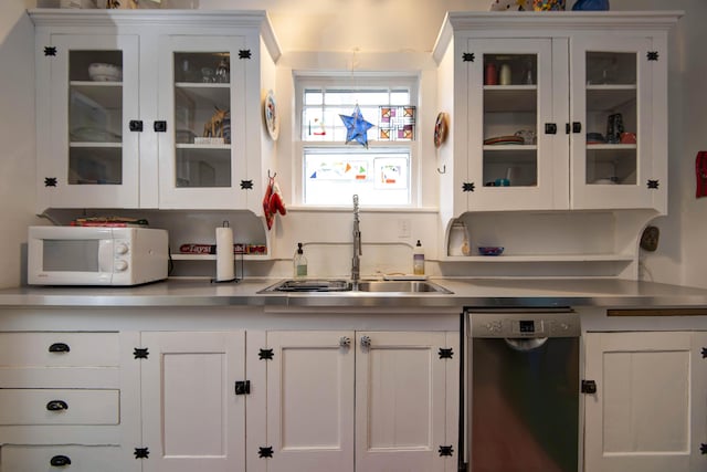 bar featuring white cabinetry and dishwasher