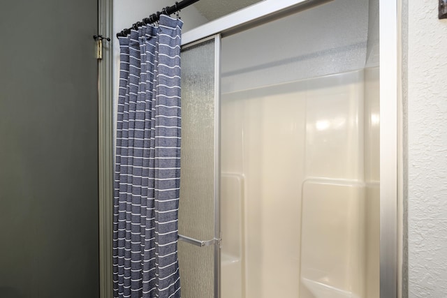 bathroom with a shower with shower curtain